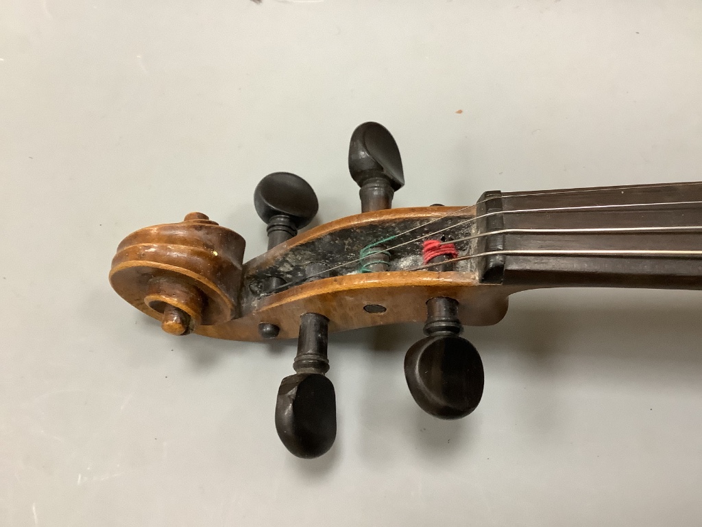 An early 20th century violin, unlabelled case, with bow, length 60cm